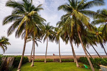 beach shore with waves and fishing boat
