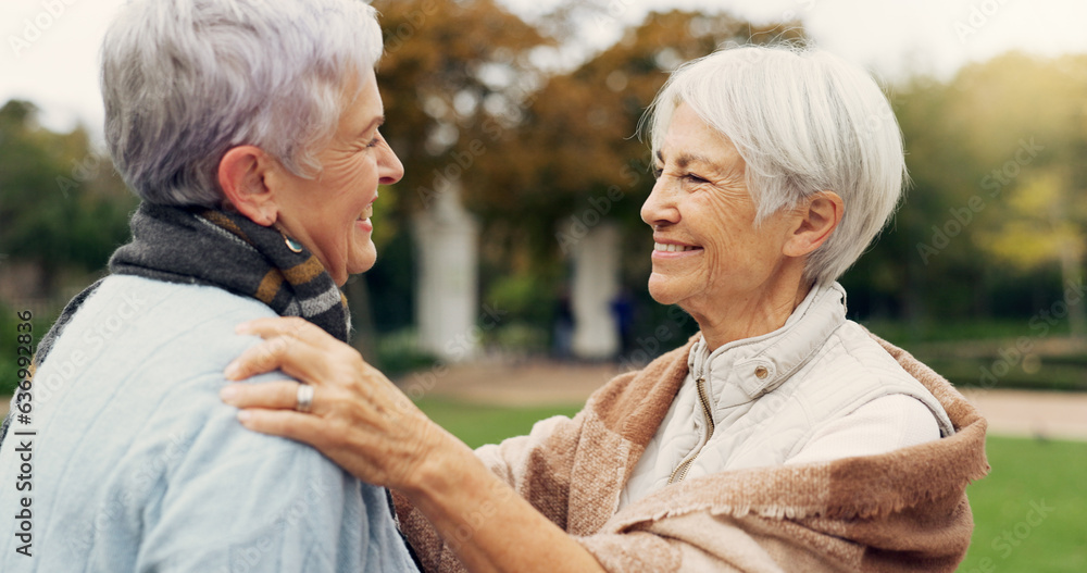 Wall mural Love, care and senior women embracing for affection, romance and bonding on an outdoor date. Nature, commitment and elderly female couple in retirement hugging in a green garden or park together.