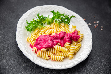 pink pasta dish beet sauce fusilli vegetable beetroot fresh food meal snack vegetarian food on the table copy space food background rustic top view
