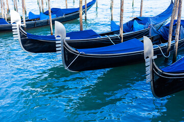Gondolas moored side, Venice, Italy.