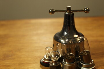 four lamps and metallic piece on the table