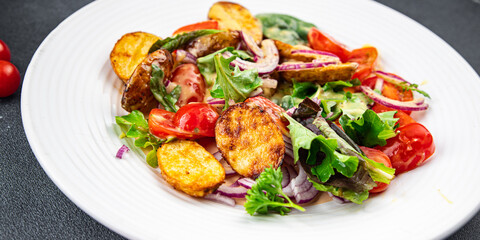 salad baked potato vegetable potato, tomato, onion, green salad leaves, salad dressing vinaigrette vegetables food healthy meal food snack on the table copy space food background rustic top view 
