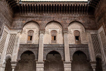 Rich decorated facade in the courtyard of the Medersa Attarine in Fes