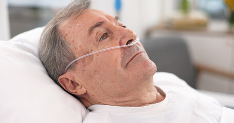 Oxygen, hospital bed and senior man with ventilation and breathing tube support in a clinic....