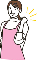 ガッツポーズをするエプロン姿の女性
