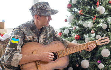Ukrainian military man with a guitar