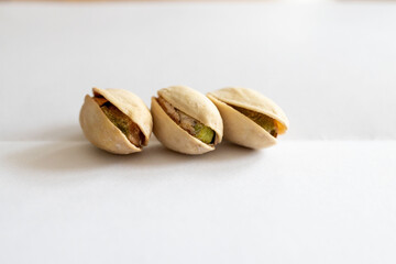 Three pistachio kernels, close-up