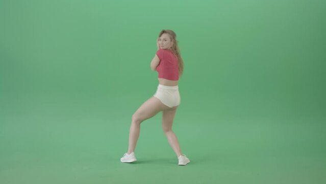 Bootie shake waving ass girl dancing twerk on green screen 4K Video Footage