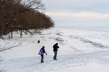 People Enjoying A Walk On Frozen Lake Winnebago, Wisconsin, During Sturgeon Spearing Season In February
