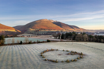 Aerial view of Castlerigg Stone Circle near Keswick on a frosty blue sky morning, Lake District, UK.