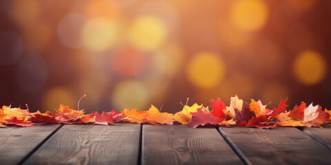 Naklejka na ściany i meble Autumn leaves on wooden table over bokeh background. Autumn, fall concept.