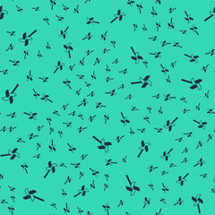 Black Pinwheel toy icon isolated seamless pattern on green background. Windmill toy icon. Vector