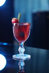 Glass of delicious refreshing sangria on counter in bar