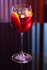 Glass of delicious refreshing sangria on counter in bar