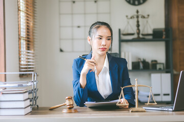 Portrait of a female lawyer in an office offering legal advice Legal service, advice, justice and real estate concept.