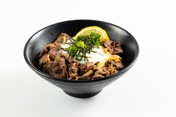 Beef Bowl. bowl of white rice topped with slices of grill beef. Japanese food on restaurant table. Isolate on white background