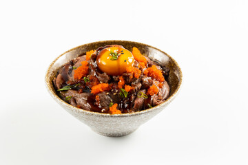 Beef Bowl. bowl of white rice topped with slices of grill beef. Japanese food on restaurant table. Isolate on white background