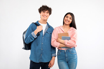 Boyfriend and Girlfriend Posing With Backpack And Textbooks, White Background