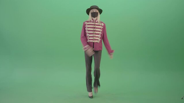 Blonde Covid girl in pink red royal uniform and medicine mask marching in front view on Green Screen 4K Video Footage