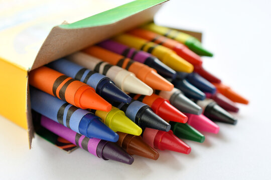 Colorful brand new Crayola crayons in a box - back to school concept