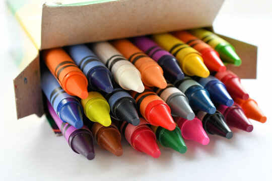Colorful brand new Crayola crayons in a box - back to school concept