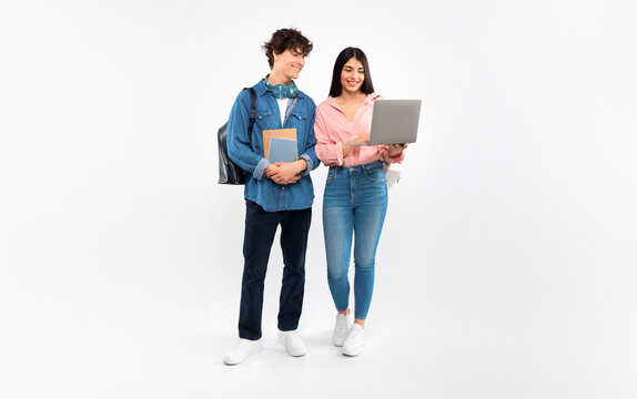 Happy Students Couple Using Laptop Studying On White Background