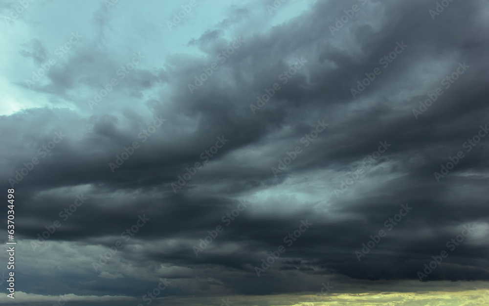 Poster the dark sky with heavy clouds converging and a violent storm before the rain.bad or moody weather s