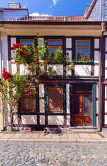 Fototapeta na wymiar Beautiful facades of old German half-timbered houses in Wernigerode.