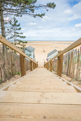 Steps down to beach huts at Wells
