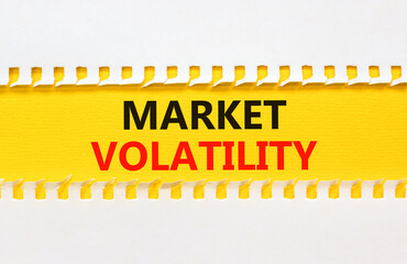 Market volatility symbol. Concept words Market volatility on beautiful yellow paper. Beautiful...