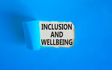Inclusion and wellbeing symbol. Concept words Inclusion and wellbeing on beautiful white paper. Beautiful blue background. Motivational inclusion and wellbeing concept. Copy space.