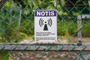 a notice sign of telecommunication transmitter tower
