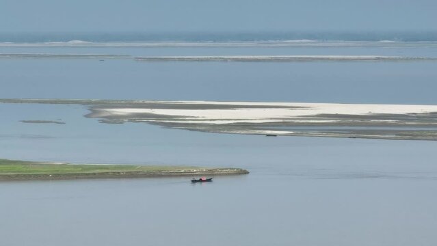 The aerial view of the Jamuna River. The sandbar villages are a unique feature of the Jamuna River. These villages are constantly shifting as the river erodes and deposits sand. 