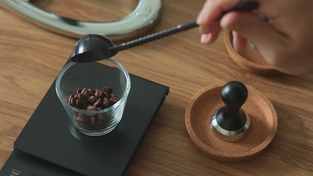 Weigh the coffee beans to prepare them for making coffee-video stock video