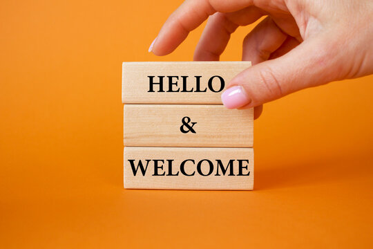 3 blocks even businessman hand orange background concept word hello and welcome