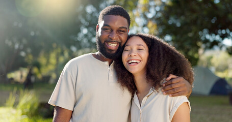 Love, diversity and a camping couple hugging outdoor in nature together while bonding for...