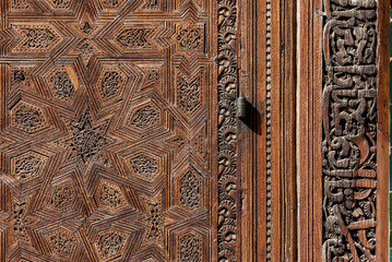 Traditional oriental facade at the courtyard of madrasa Bou Inaniya in the medina of Fes
