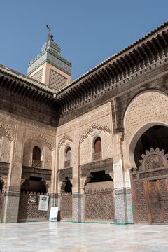 Traditional oriental facade at the courtyard of madrasa Bou Inaniya in the medina of Fes