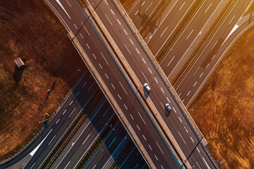 Aerial shot of cars on freeway overpass from drone pov
