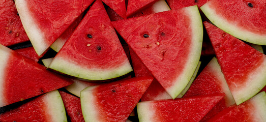 heap of fresh sliced watermelon as textured background