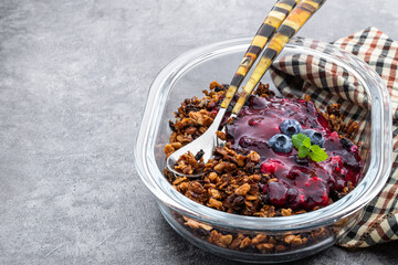 Blueberry crisp baked oatmeal on gray background