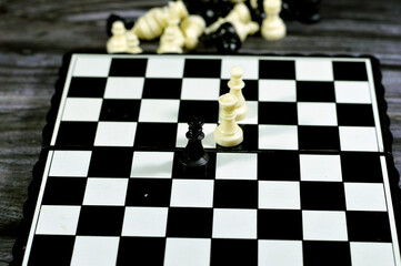Chess, a board game for two players, called white and black, each controlling an army of chess...