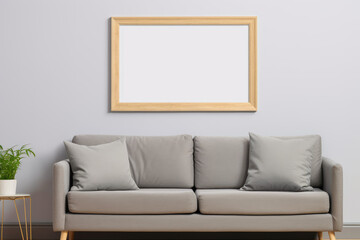 Blank white wall art mockup. One horizontal frame with wooden border. Living room