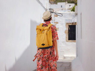 Nice asian Female in boho dress Enjoying Sunny Day on Greek Islands. Travel to Lindos,...