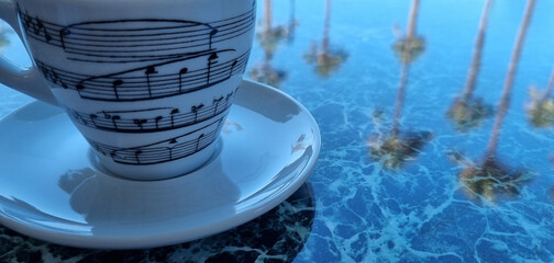 Coffee cup with musical notes on it. A background of reflections.