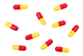 Red yellow capsules isolated on white, clipping