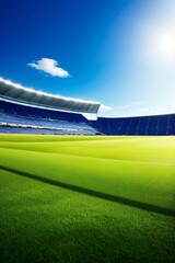 a football field with blue seats and a blue sky