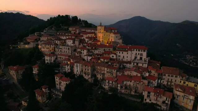Aerial footage of the Sacro Monte of Varese at sunset, this sacred mount is a historic pilgrimage site and Unesco World Heritage for the Sanctuary of Santa Maria del Monte, Varese, Lombardy, Italy