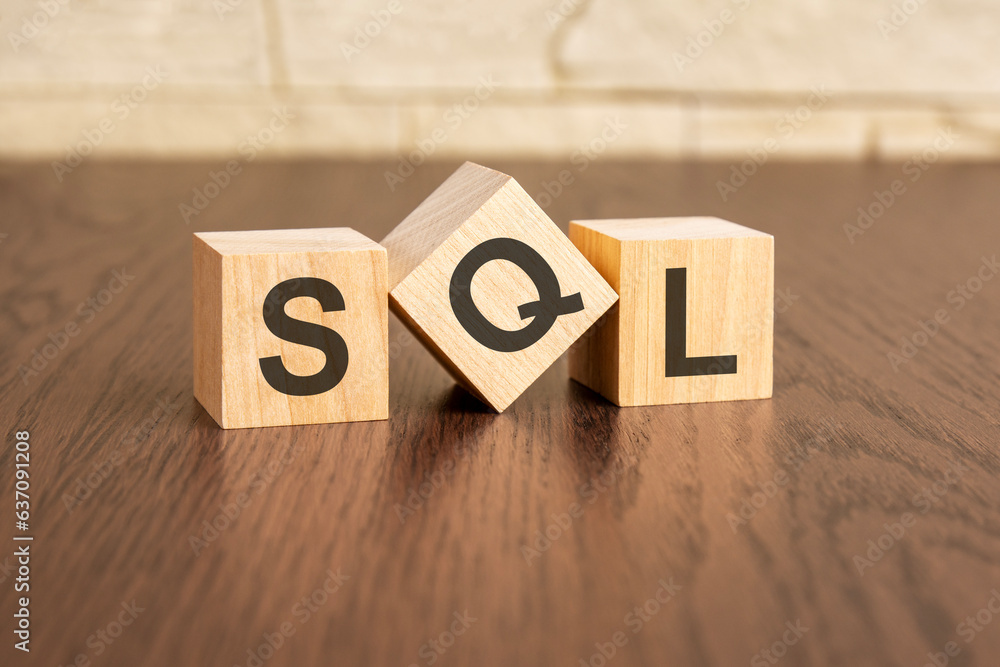 Poster concept with symbols sql on wooden blocks