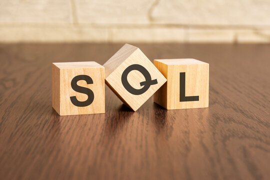 concept with symbols SQL on wooden blocks